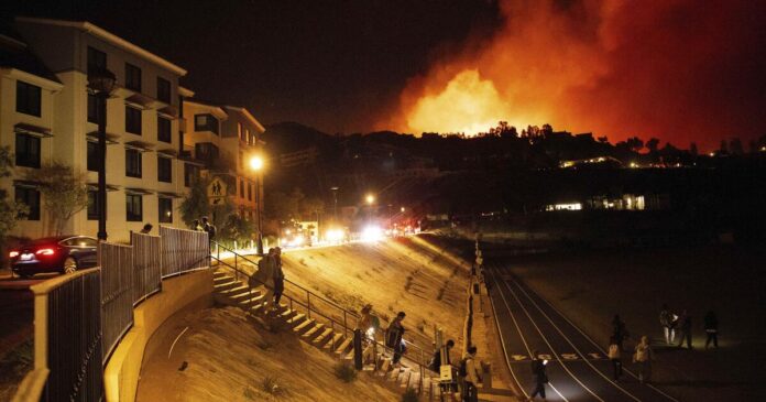 Through a window, Pepperdine students watch Malibu fire engulf campus