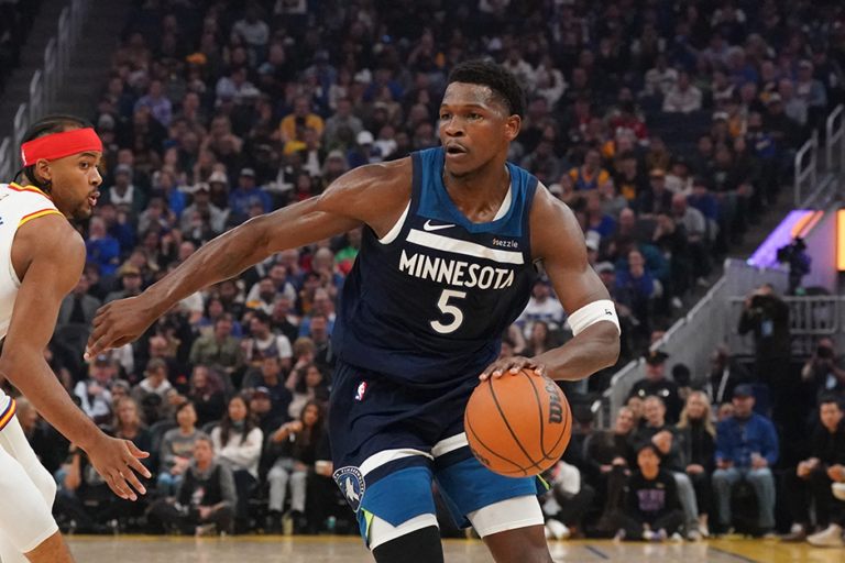 Timberwolves guard Anthony Edwards driving to the basket against Golden State Warriors guard Moses Moody in the first period at Chase Center on Sunday.